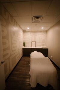 A serene massage room at the best salon in Waukee and Urbandale, near balayage, highlights, hair extensions, and bridal hair.