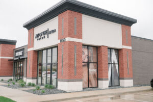 Art of Life Aveda Salon, a modern red-brick salon in Waukee/Urbandale, offers balayage, highlights, hair extensions & bridal hair.