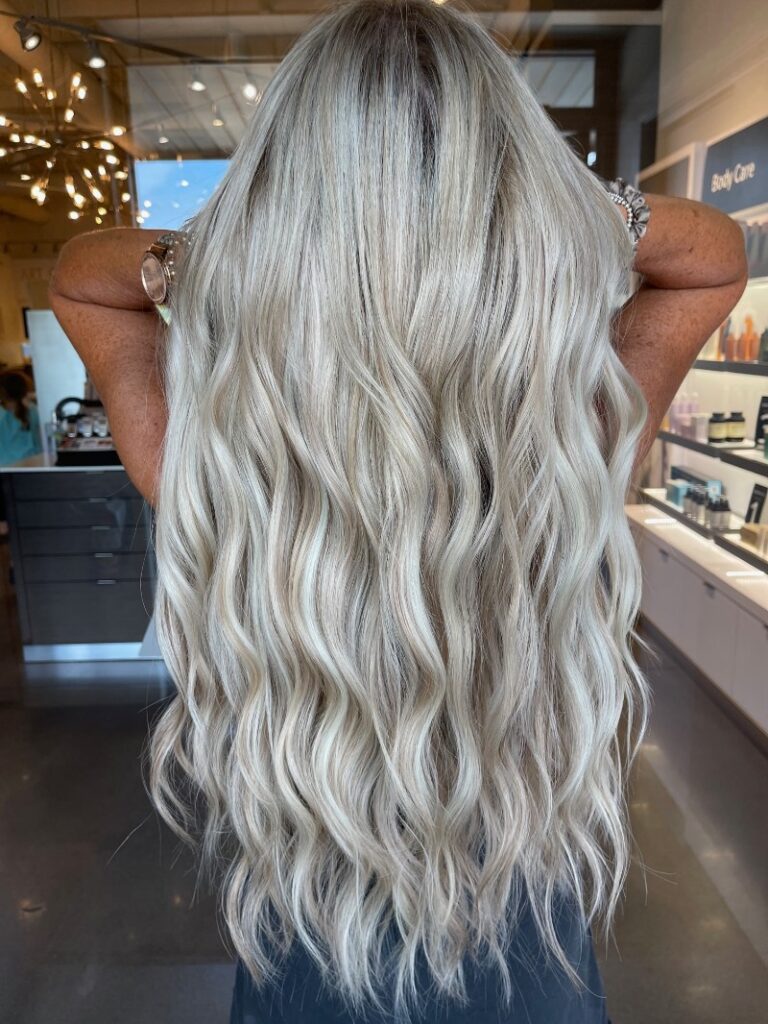 - Art of Life Salon & Spa at Urbandale and Waukee, IA Client with long, wavy platinum blonde hair at the best salon in Waukee and Urbandale, known for balayage, highlights, hair extensions, bridal hair, and permanent jewelry. - Art of Life Salon & Spa at Urbandale and Waukee, IA