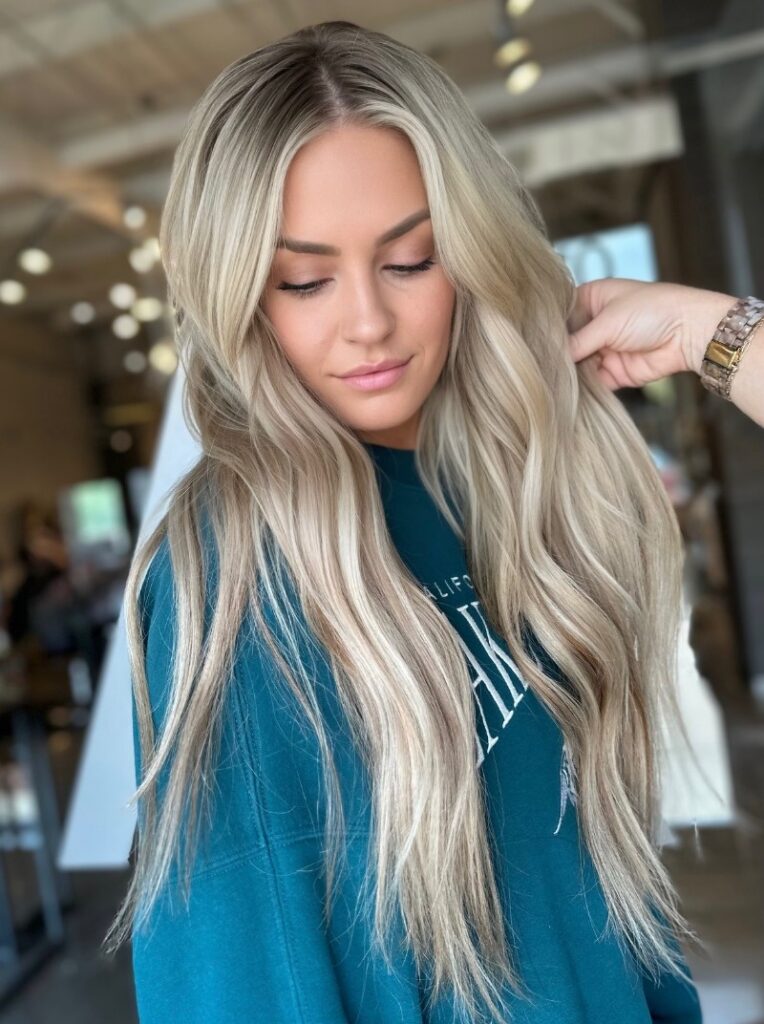 - Art of Life Salon & Spa at Urbandale and Waukee, IA A woman with balayage, highlights, and hair extensions at the best salon in Waukee or Urbandale gets her bridal hair adjusted indoors. - Art of Life Salon & Spa at Urbandale and Waukee, IA