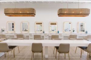 - Art of Life Salon & Spa at Urbandale and Waukee, IA Elegant modern salon interior in Waukee/Urbandale, with beige chairs, bright mirrors, ideal for balayage, highlights, hair extensions. - Art of Life Salon & Spa at Urbandale and Waukee, IA